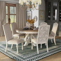Caelum 7-Piece Round Dining Set with White Fabric Upholstery by The Gray Barn