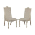 Caelum 7-Piece Round Dining Set with White Fabric Upholstery by The Gray Barn